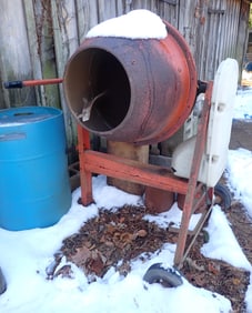Concrete Mixer & Pile of Block