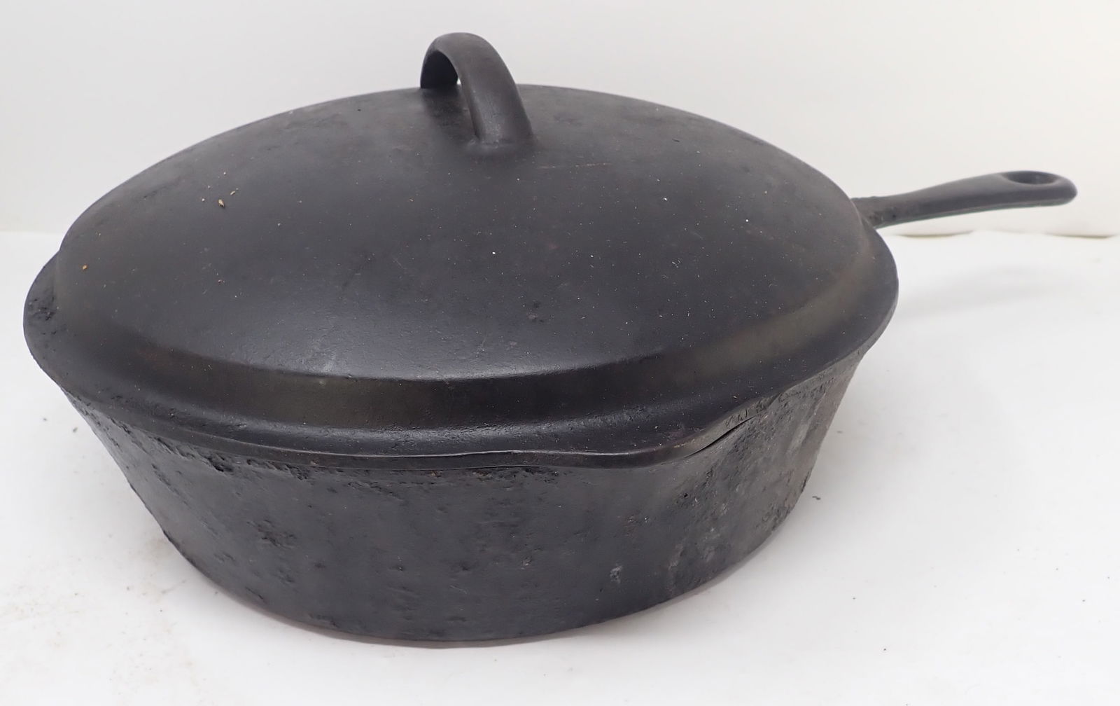Deep Covered Cast Iron Pan: Approx 11" in diameter and 3" tall ( not including height of lid). Shipping available
