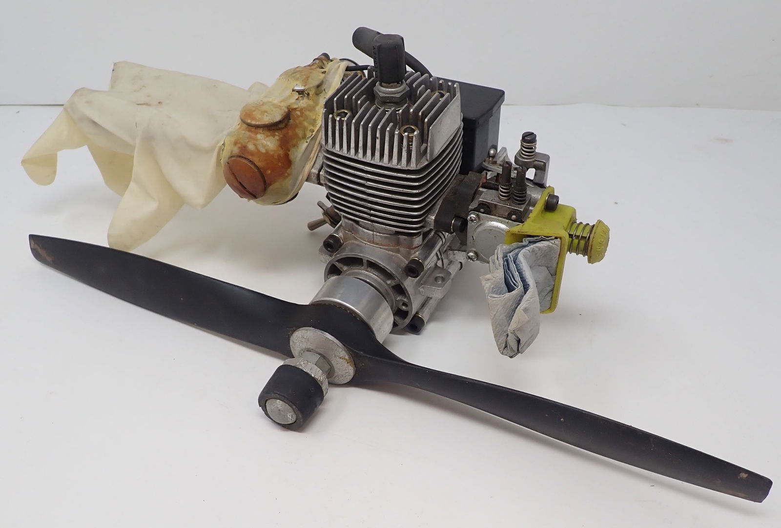 Maloney 100 Model Airplane Motor: Prop is approx 15" long. Second pic is how they had it stored. Shipping available