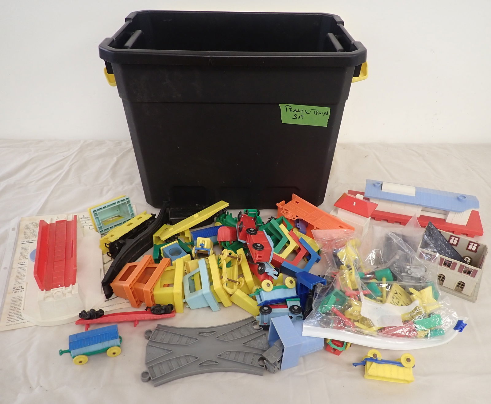 Plastic Train Sets: We do not guarantee they are complete. We will ship all items but tote. $20 handling charge, plus postage