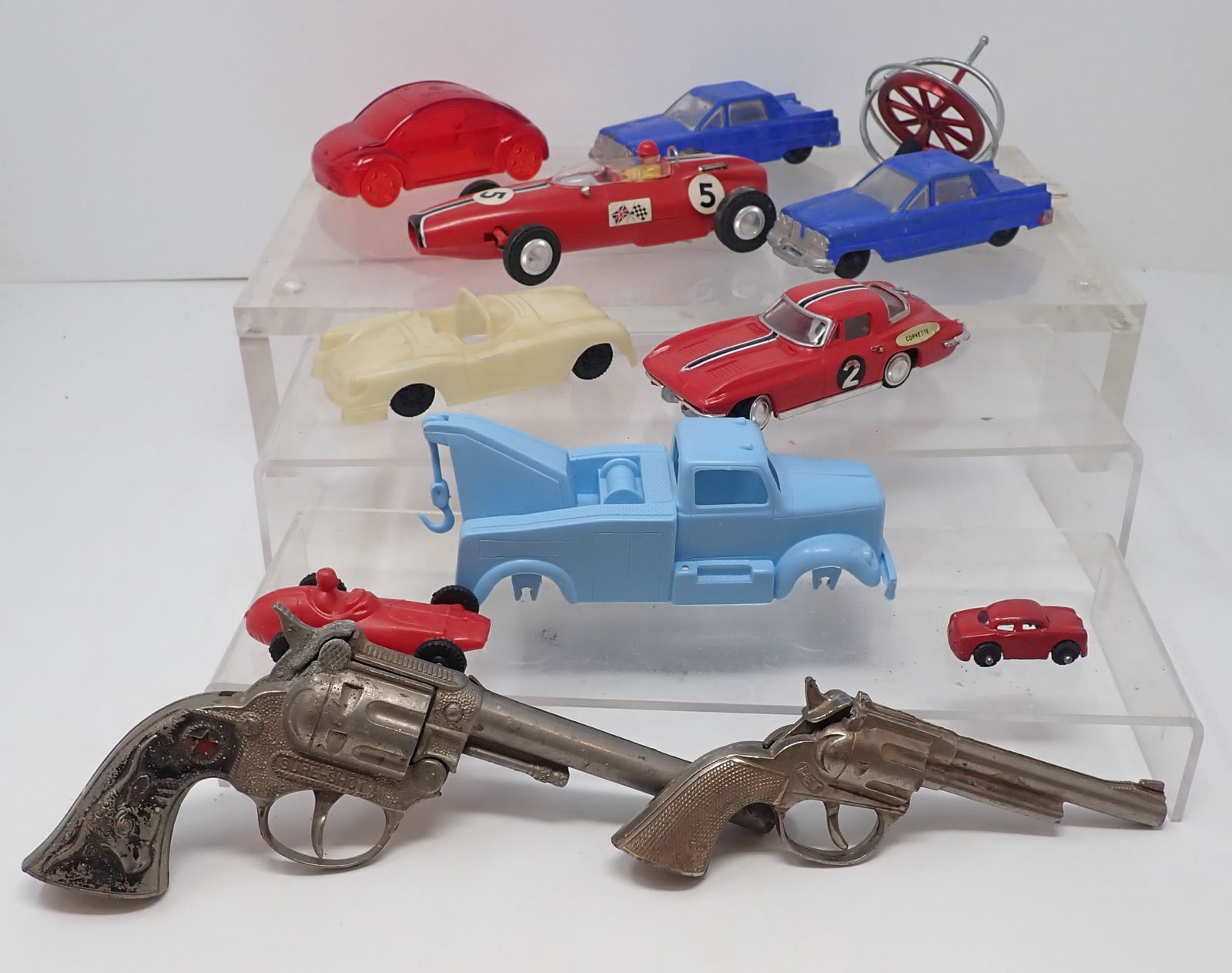 Toy Cars , Cap Guns, & Gyroscope Top: Longest car is apprx 6 1/4" long. Shipping available