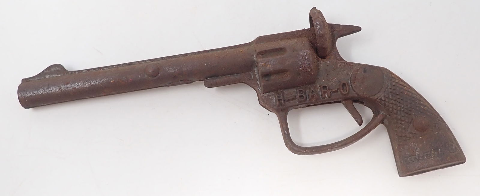 H-Bar-O Cast Iron Cap Gun: Apprx 7 1/2" long. Shipping available