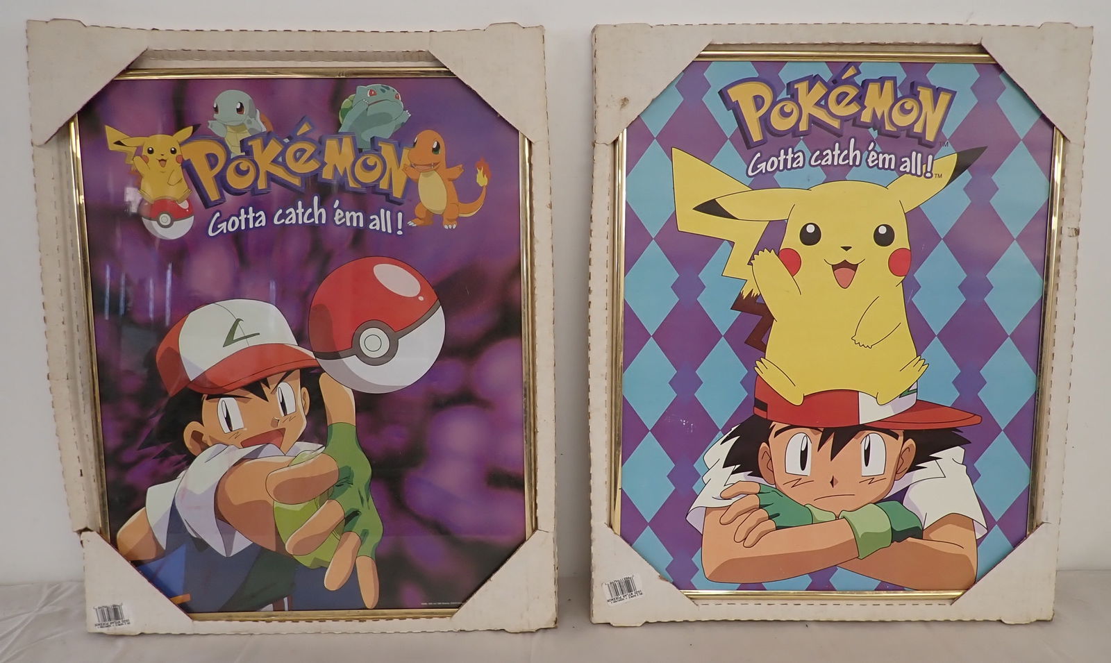 2 Framed Pokemon Posters: Approx 16" x 20 1/4". Shipping available ($20 handling charge, plus postage)
