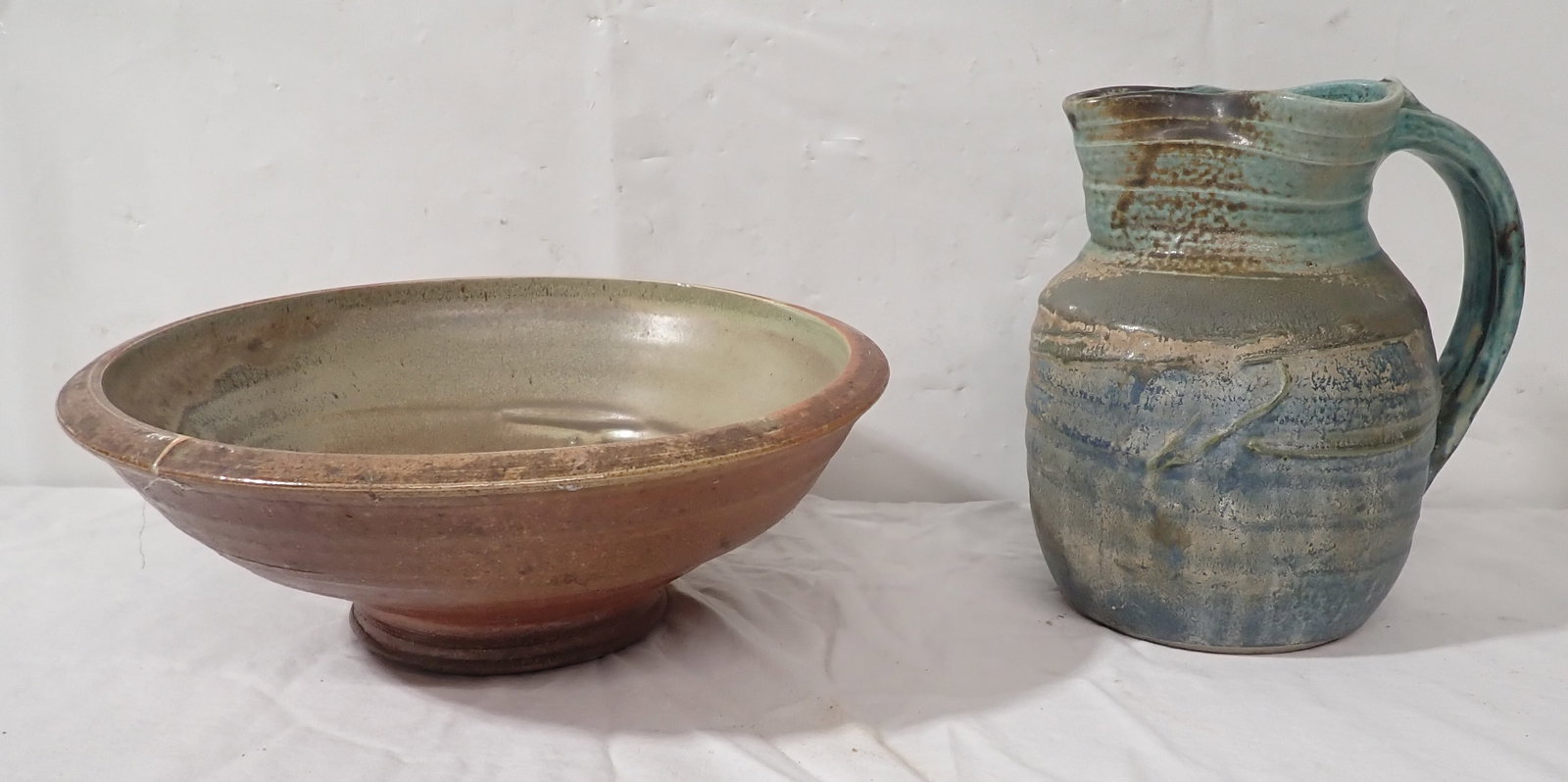 Signed Pottery Bowl & Pitcher: Bowl is approx 11" in diameter and 4" tall. Shipping available