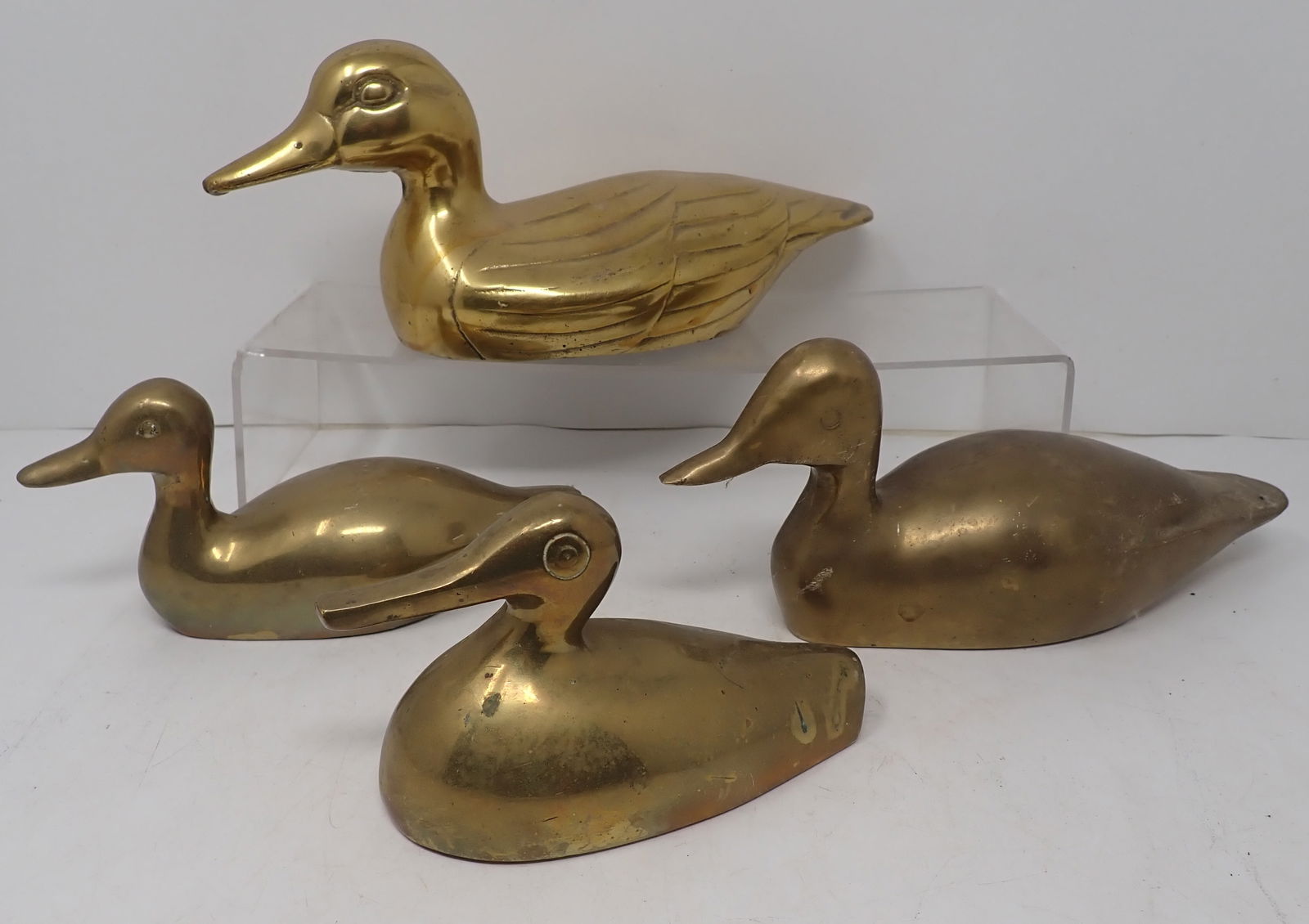 4 Brass Ducks: Largest is apprx 10" long and 4 1/4" tall. Shipping available