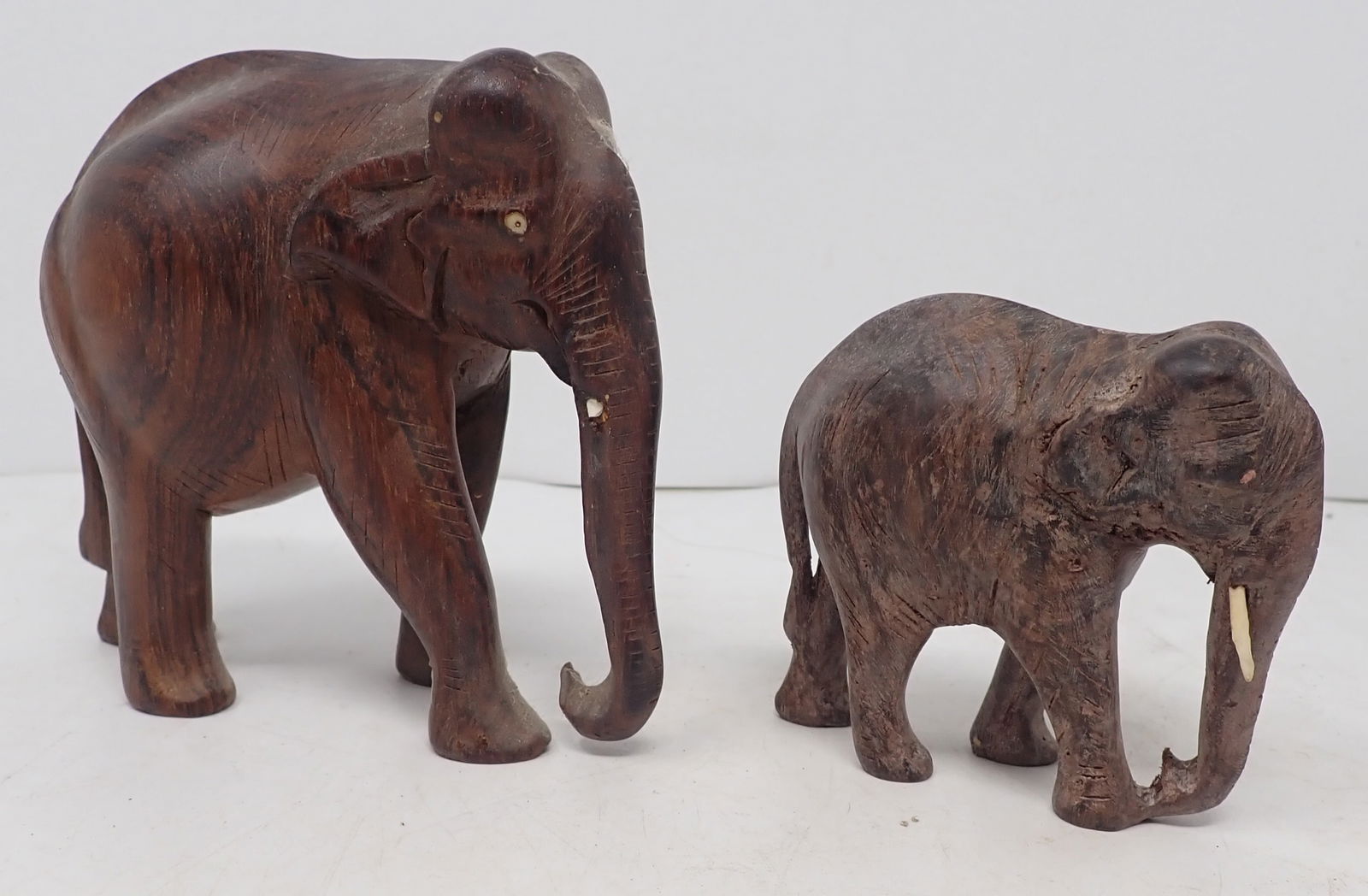 2 Wooden Elephants: Tallest is apprx 4 1/4" tall. Shipping available