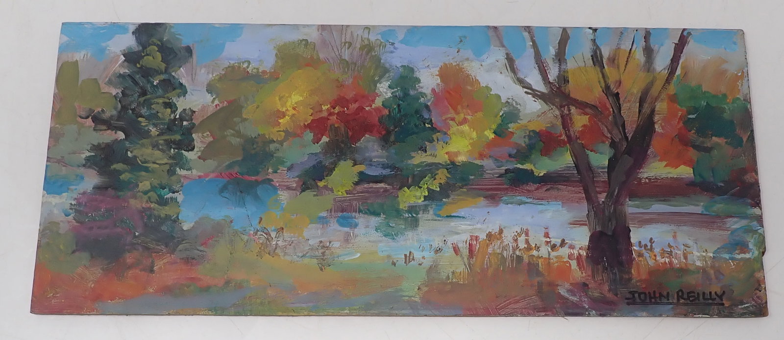 John Reilly Oil on Board Landscape Painting: Signed painting is approx 5" x 12". Shipping available
