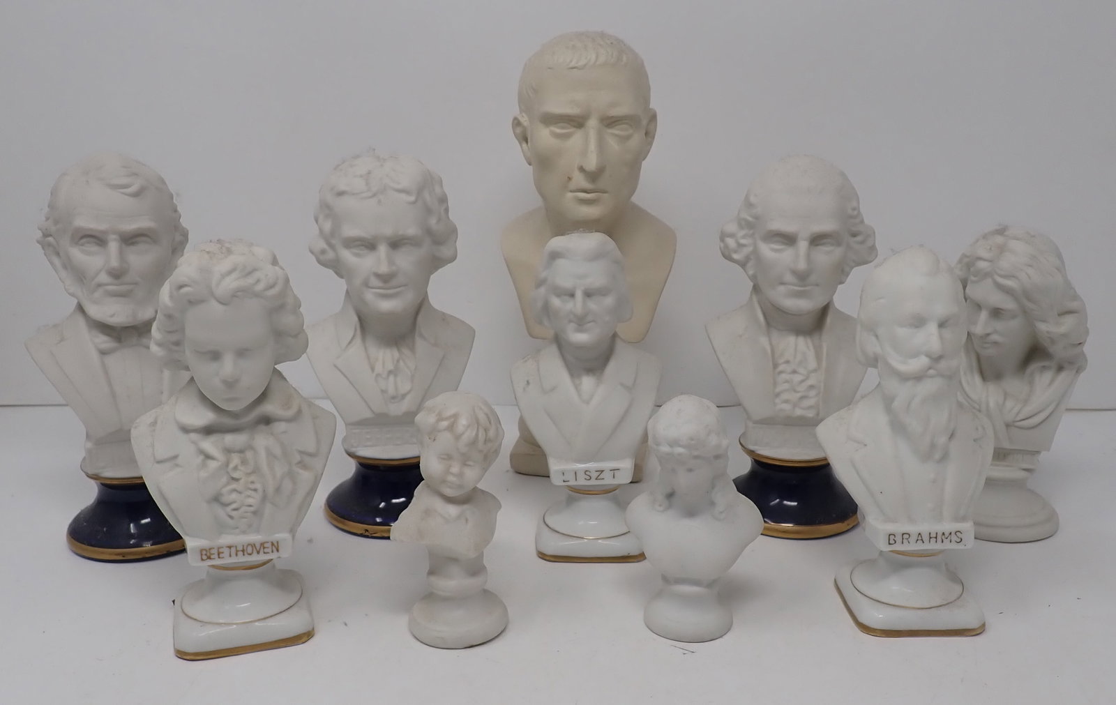 Pottery & Porcealin Busts: Tallest is approx 8" tall and is pottery. All the rest are porcelain. Shipping available ($30 handling charge, plus postage)