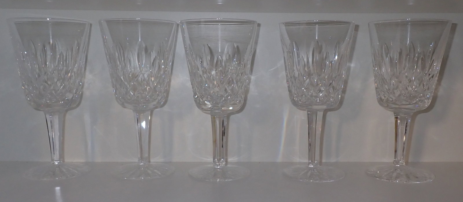 5 Waterford Crystal Wine Goblets: Apprx 3 3/8" in diameter and 7" tall. Shipping available ($20 handling charge, plus postage)