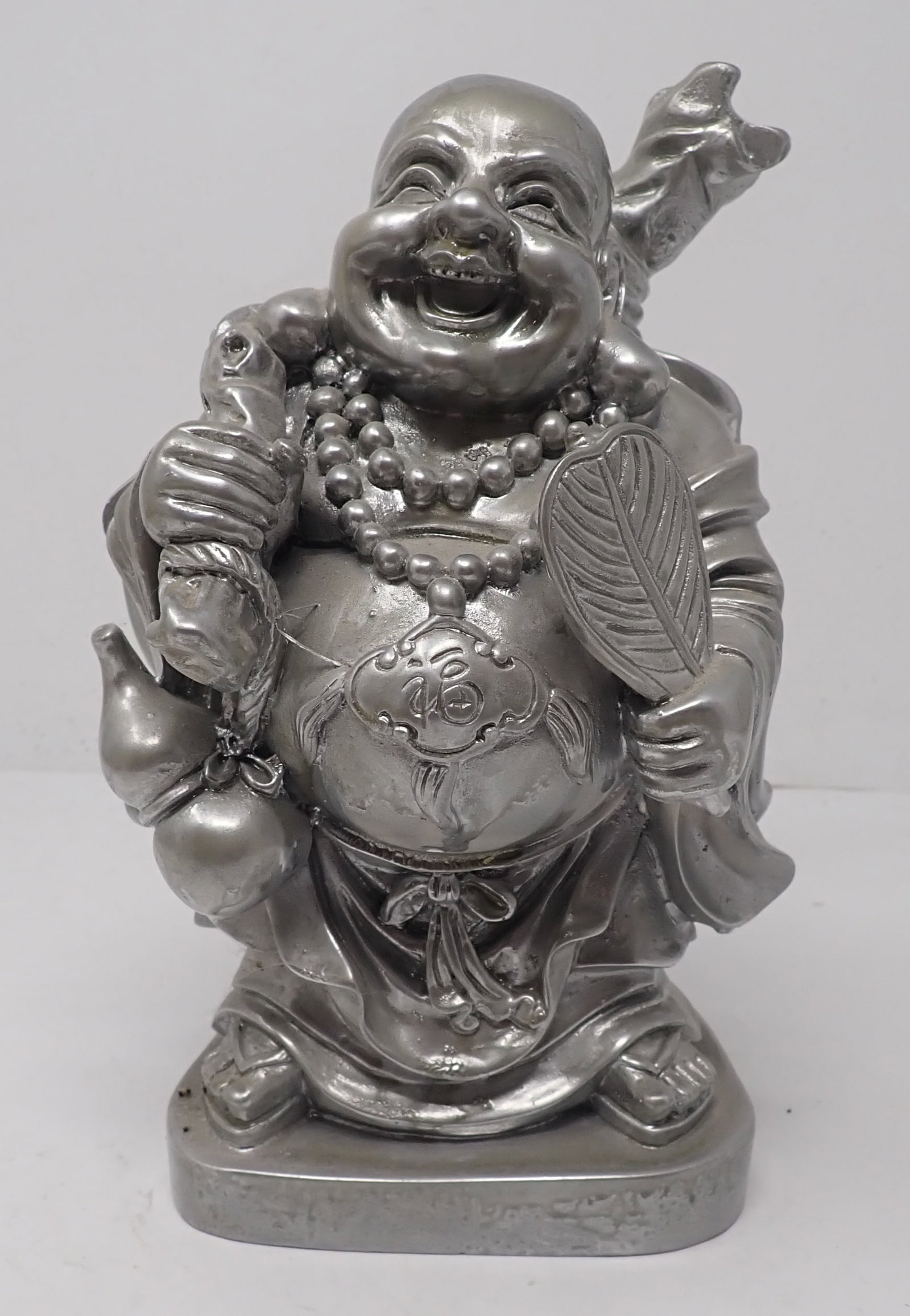 Laughing Buddha Statue: Approx 8 3/4" tall. Seems to be made of resin and has been repainted. Shipping available