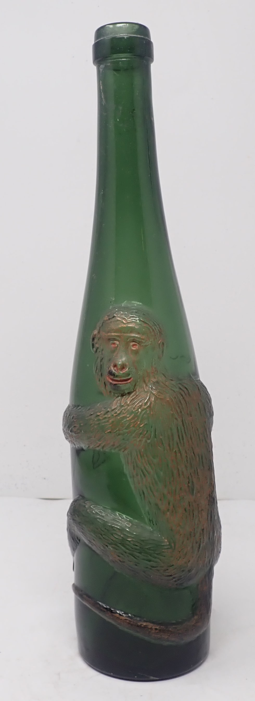 Green Wine Bottle w/ Embossed Monkey: Apprx 13 1/2" tall. Shipping available