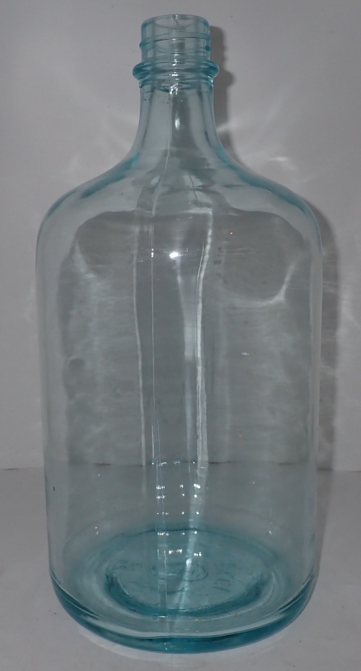 Small Glass Spring Water Bottle: Apprx 7 1/2" in diameter and 16" tall. No in house shipping !