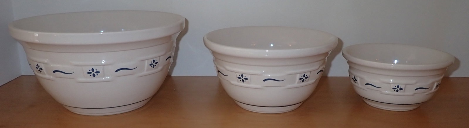3 Longaberger Pottery Mixing Bowls: Largest is approx 10 1/4" in diameter and 5 1/4" tall. Shipping available ($20 handling charge, plus postage)