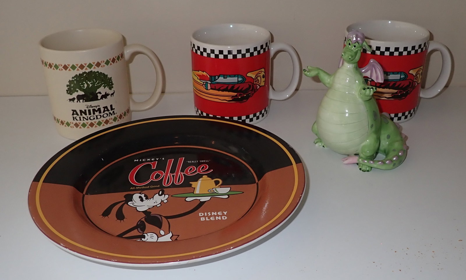 Disney Coffee Mugs, Plate , & Statue: Statue is approx 5" tall. Shipping available ($20 handling charge, plus postage)