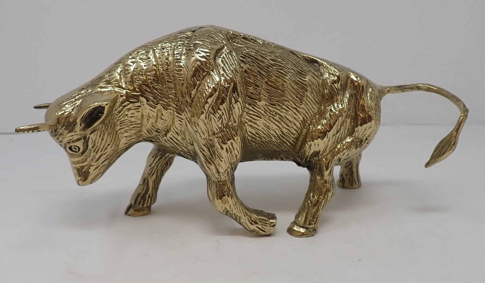 Brass Bull: Apprx 9" long, 5" tall. Made of heavy brass. Shipping available