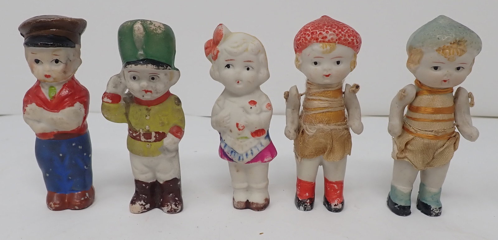 5 Bisque Figurines: Apprx 3 3/8" tall. Two on right have strung arms. Shipping available