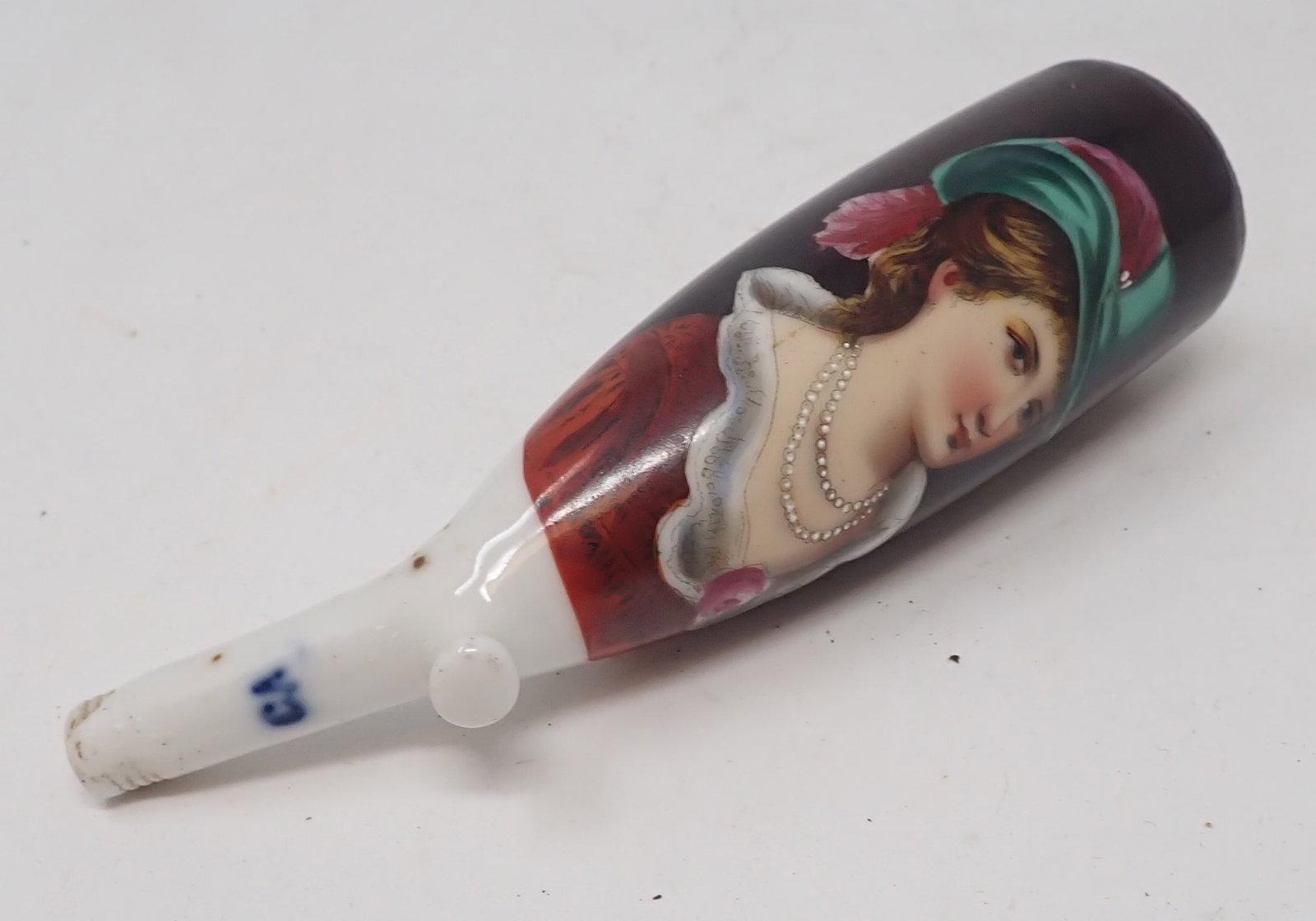 German Porcelain Tobacco Pipe: Approx 1 1/4" in diameter and 5" long. Shipping available