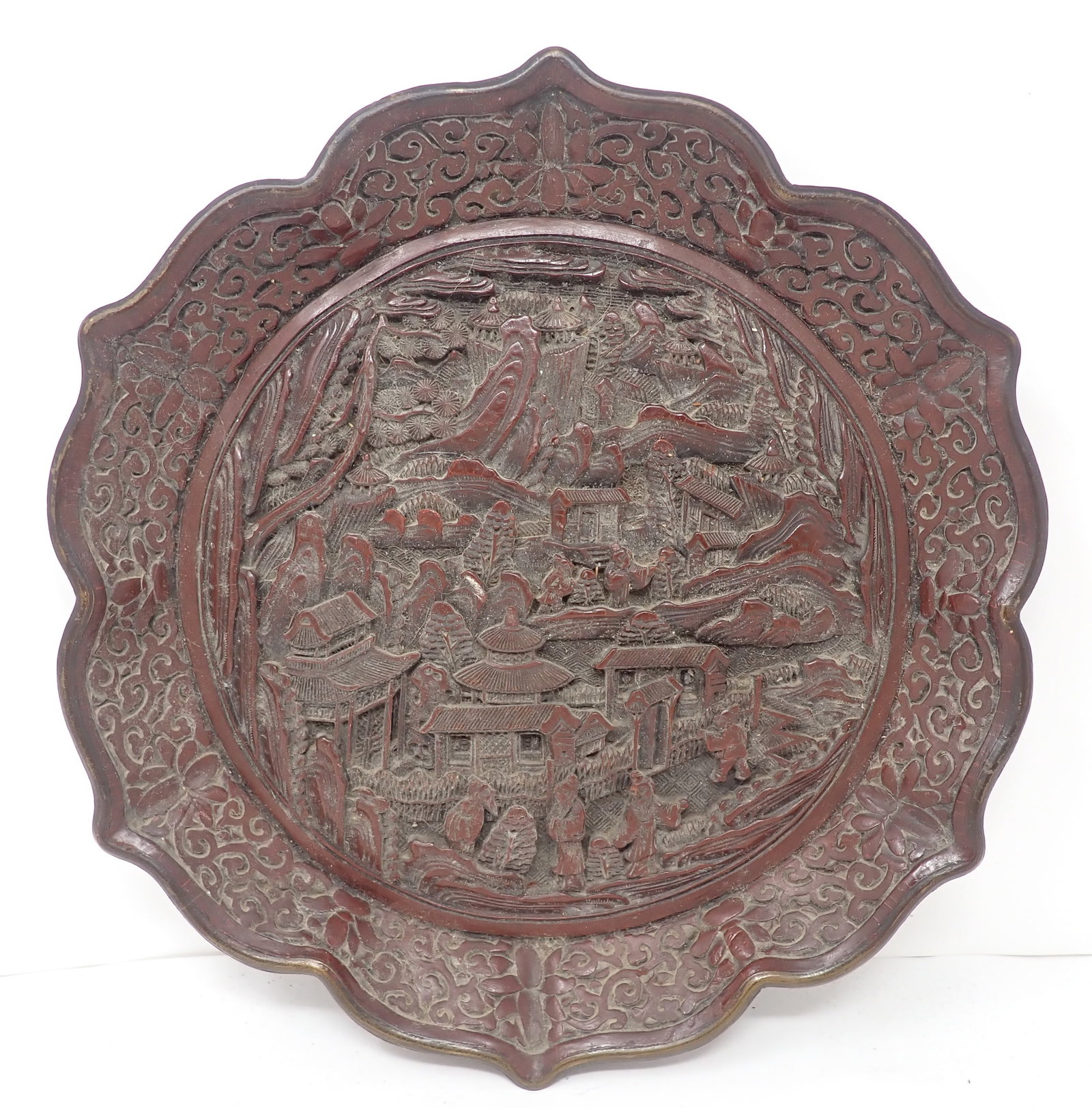 Chinese Carved Cinnabar Plate: Approx 10 1/2" in diameter. Shipping available
