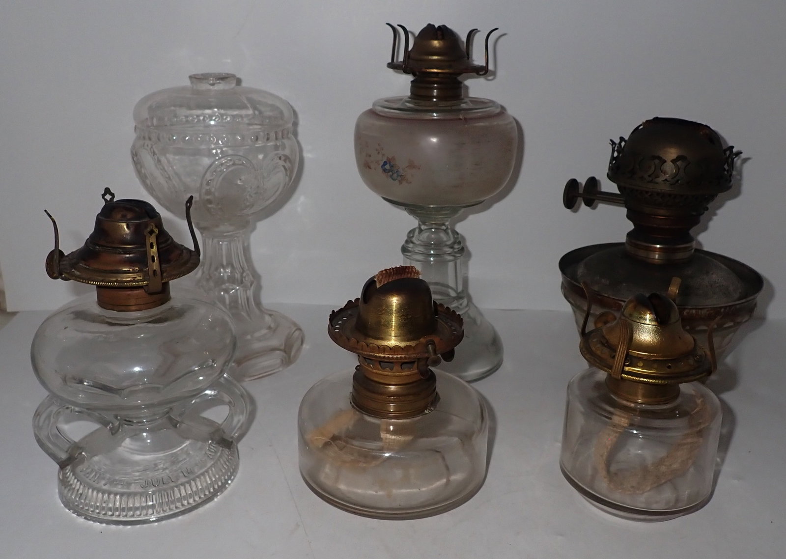 Oil Lamps: Tallest is apprx 9 1/4" tall. Shipping available ($20 handling charge, plus postage)