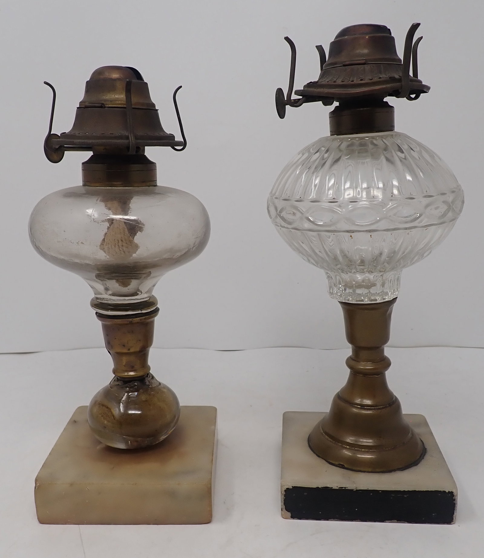 2 Early Oil Lamps: Tallest is approx 9 1/2" tall. Shipping available