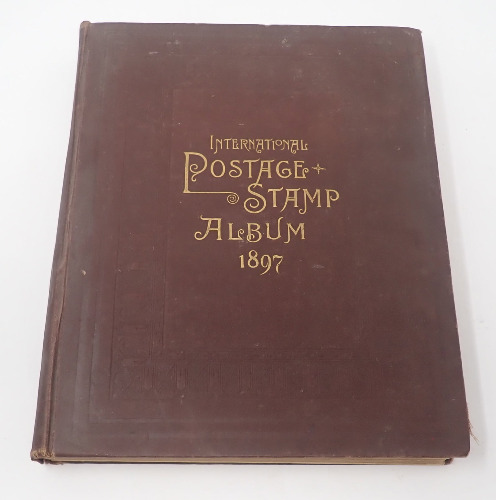 1897 International Postage Stamp Album: Not all are pictured. Shipping available
