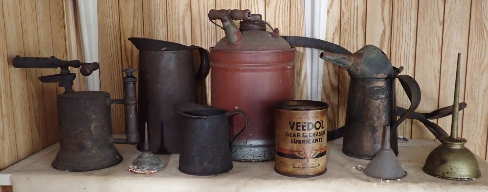 Oil Cans, Veedol Gear Lube, Gas Can, & Ice Tongs: Back right oil can is copper. Tallest is apprx 10" tall. No in house shipping !