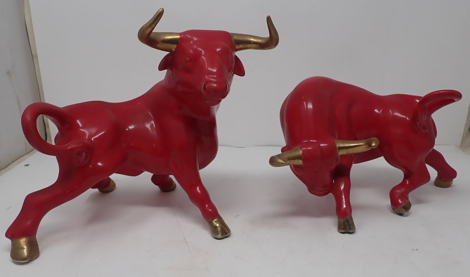 Ceramic Bulls: Left one is approx 11" long and 8 3/4" tall. Shipping available