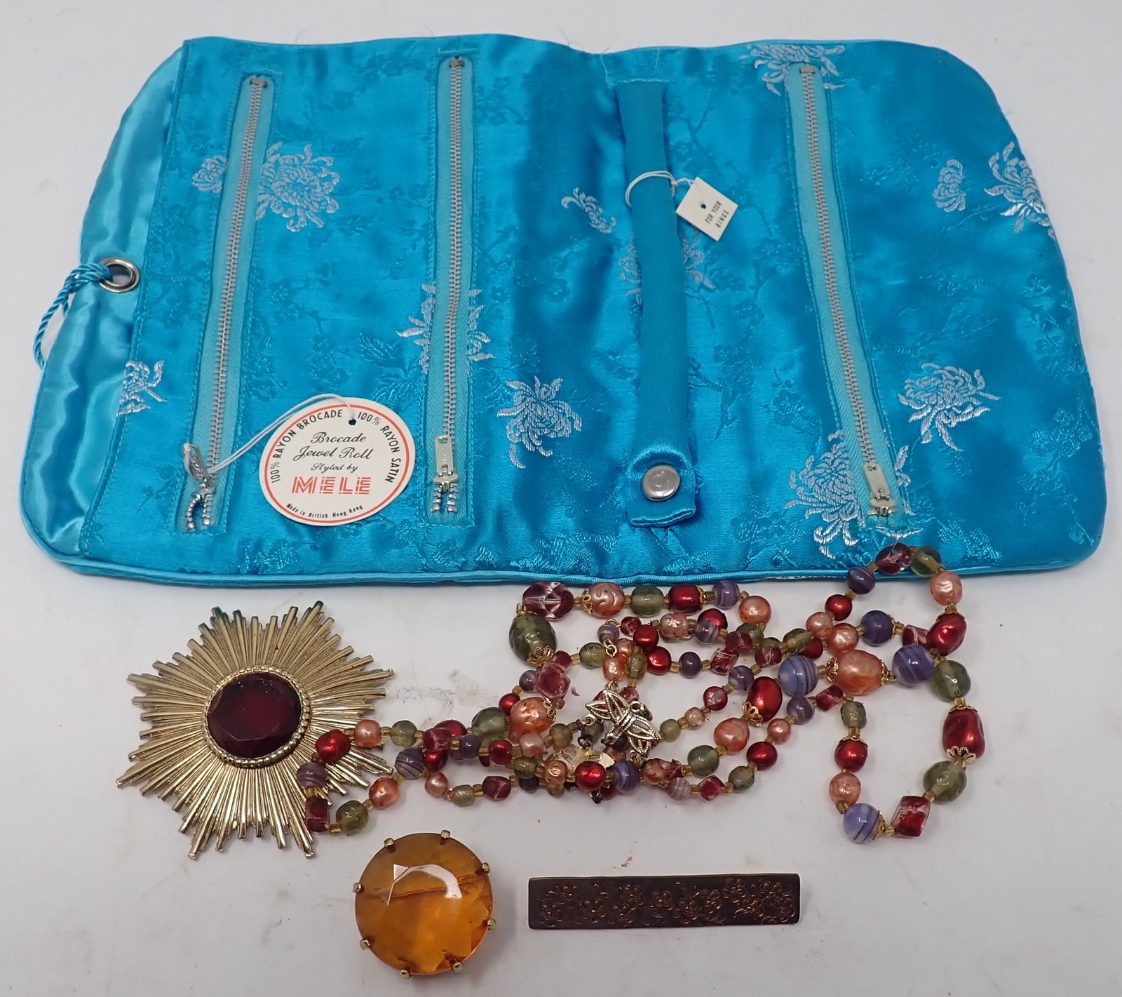 Mele Jewel Bag & Costume Jewelry: Bag is approx 8 1/2" x 12 3/8". Shipping available