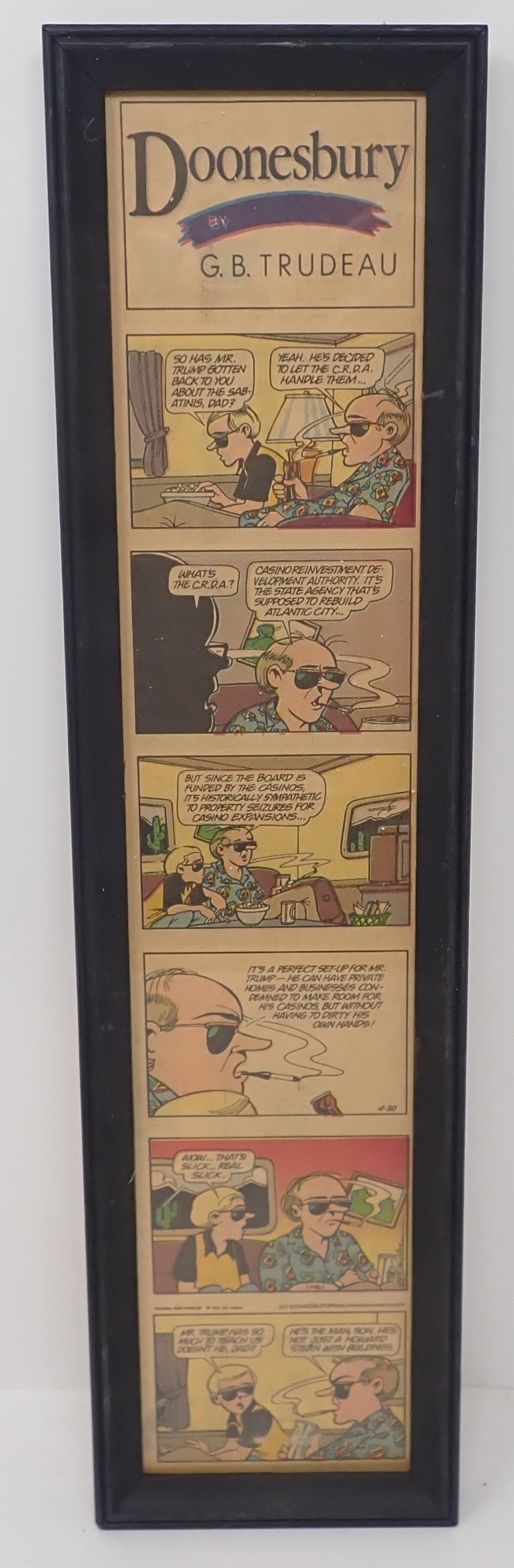 Framed G.B Trudeau Doonesbury Comic: Approx 4" x 15 7/8". Shipping available