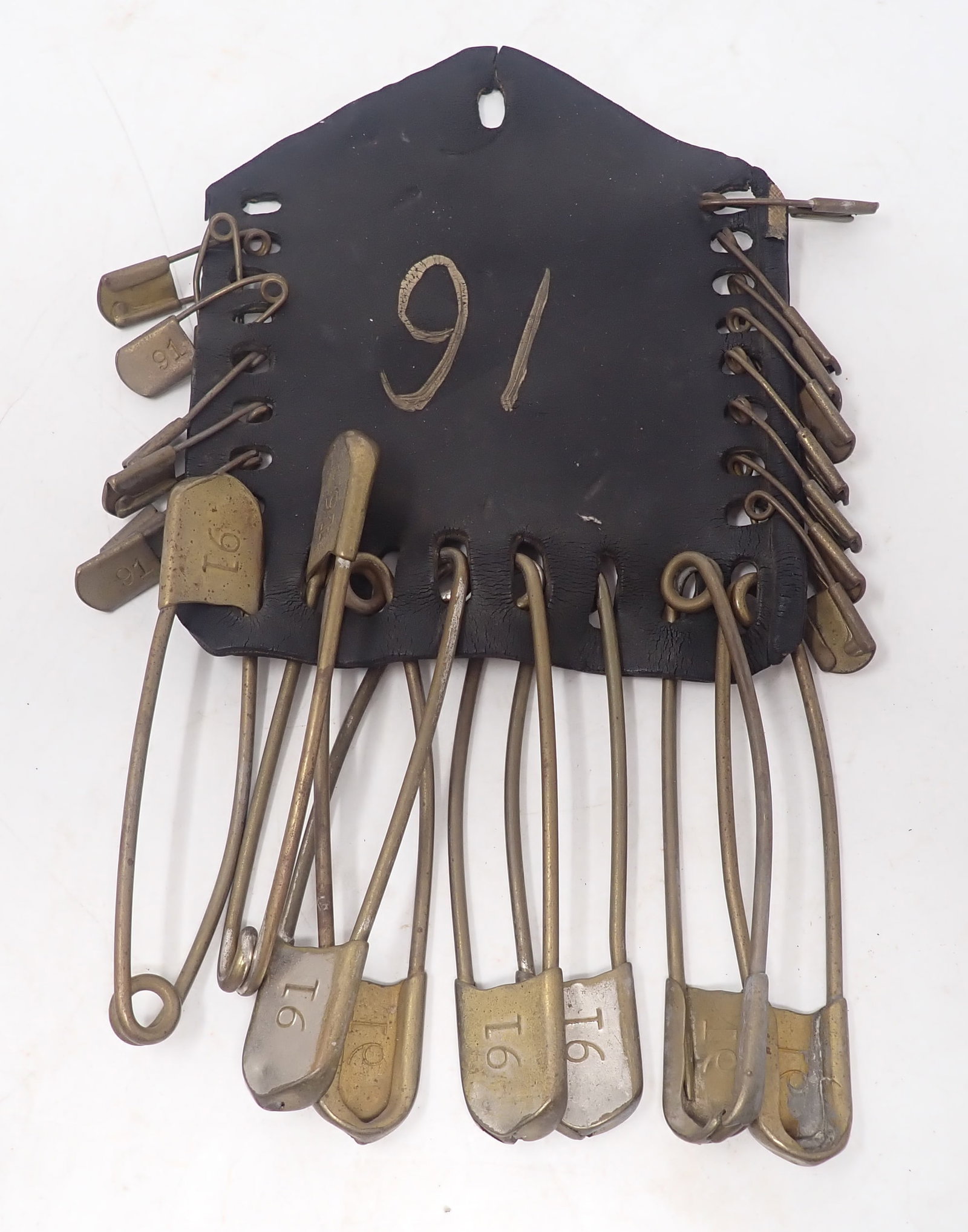 Leather Military Laundry Tag Holder w/ Brass Safety Pins: Leather is apprx 6" x 7". Largest pins are apprx 5 3/8". Shipping available