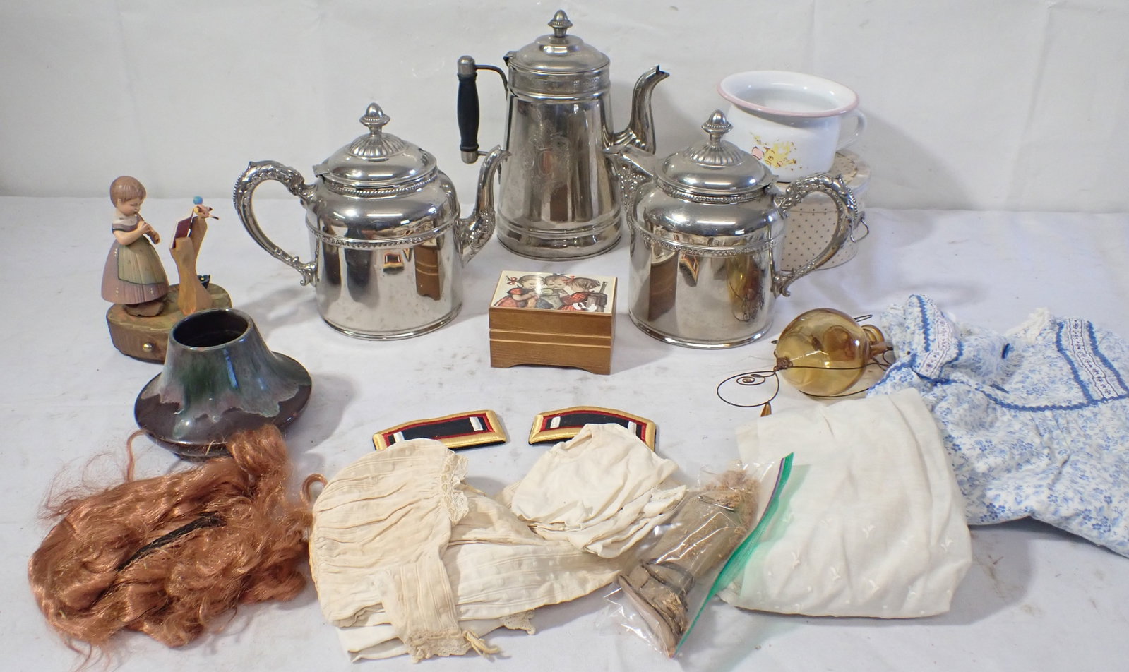 Teapots, Enameled Childs Chamber Pot, Doll Clothes, & Misc: Largest teapot is approx 10" tall. Must take all ! No in house shipping !