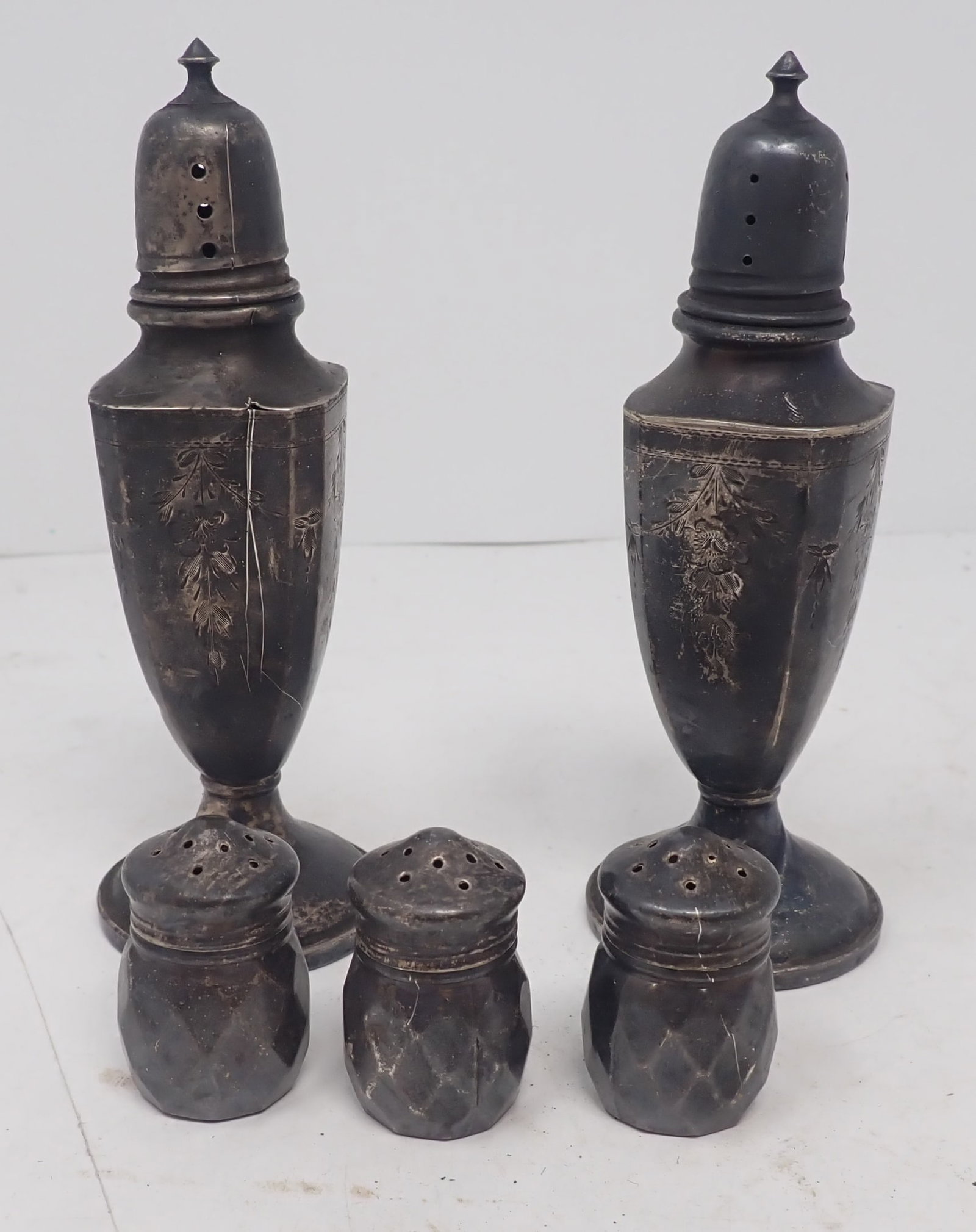 Sterling Silver Salt & Pepper Shakers: Tallest are weighted and approx 5 1/8" tall and weigh apprx 66.16 dwt . Three small ones weigh 8.72 dwt. Shipping available