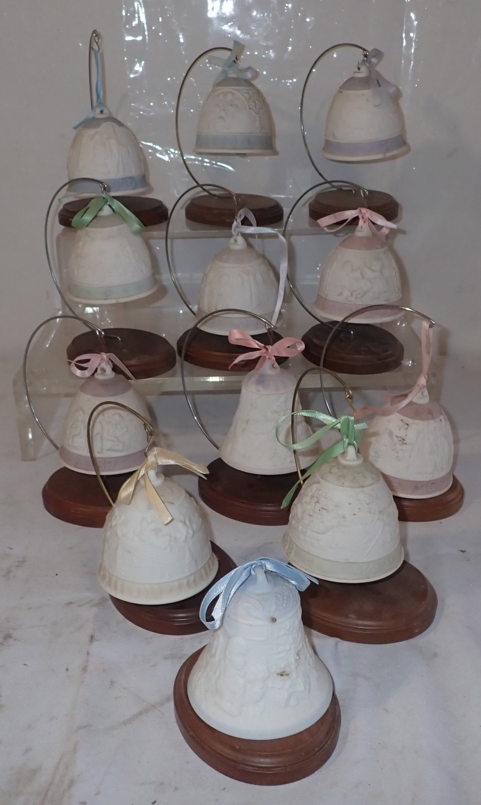 12 Lladro Bells: Bells are approx 3 1/8" in diameter and 3 1/4" tall. Shipping available ($25 handling charge, plus postage)