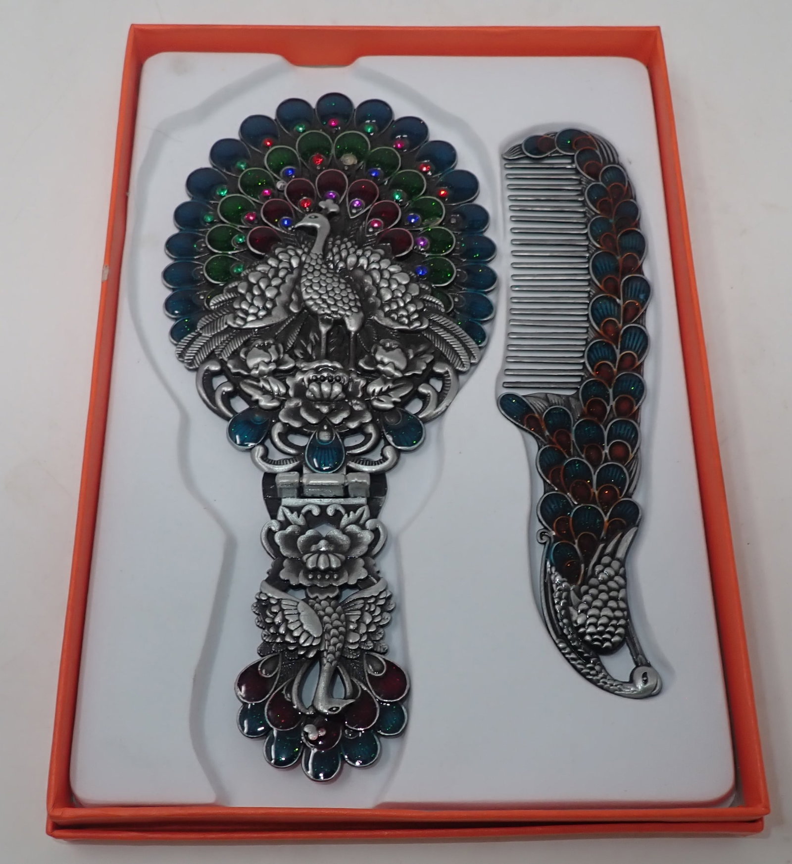 Peacock Comb & Mirror: Mirror is apprx 3 7/8" x 8 1/4". Shipping available