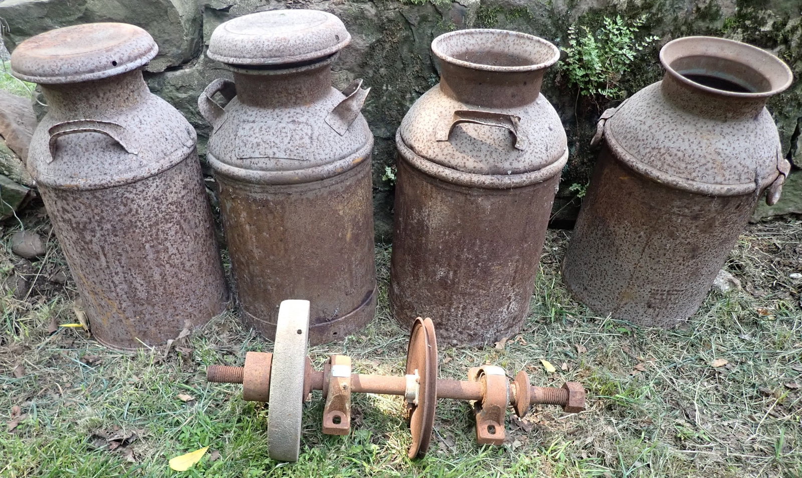 4 Rusty Milk Cans & Grinding Stone: No in house shipping !
