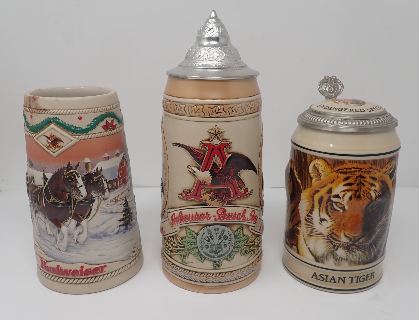 3 Budweiser Steins: Tallest is approx 9 3/8" tall. Shipping available