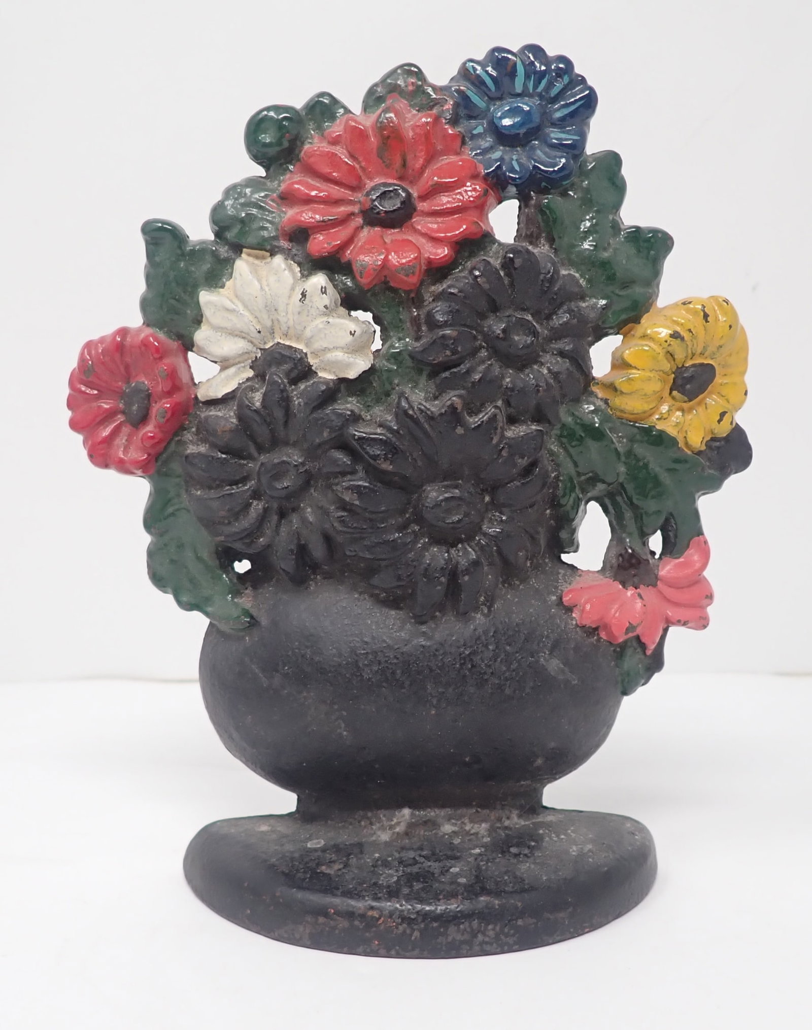 Cast Iron Flowers Doorstop: Apprx 7" tall. Shipping available