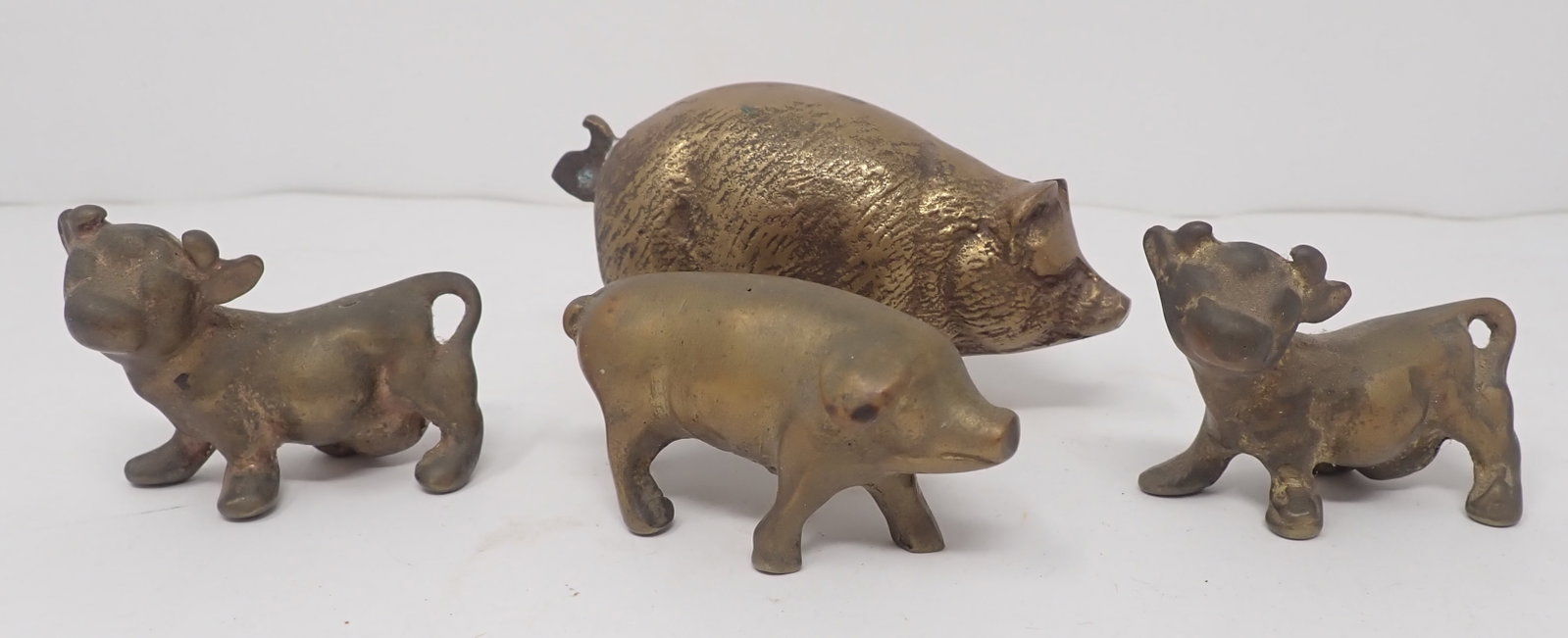 Brass Cows & Pigs: Largest is apprx 3 1/2" long and 2" tall. Shipping available