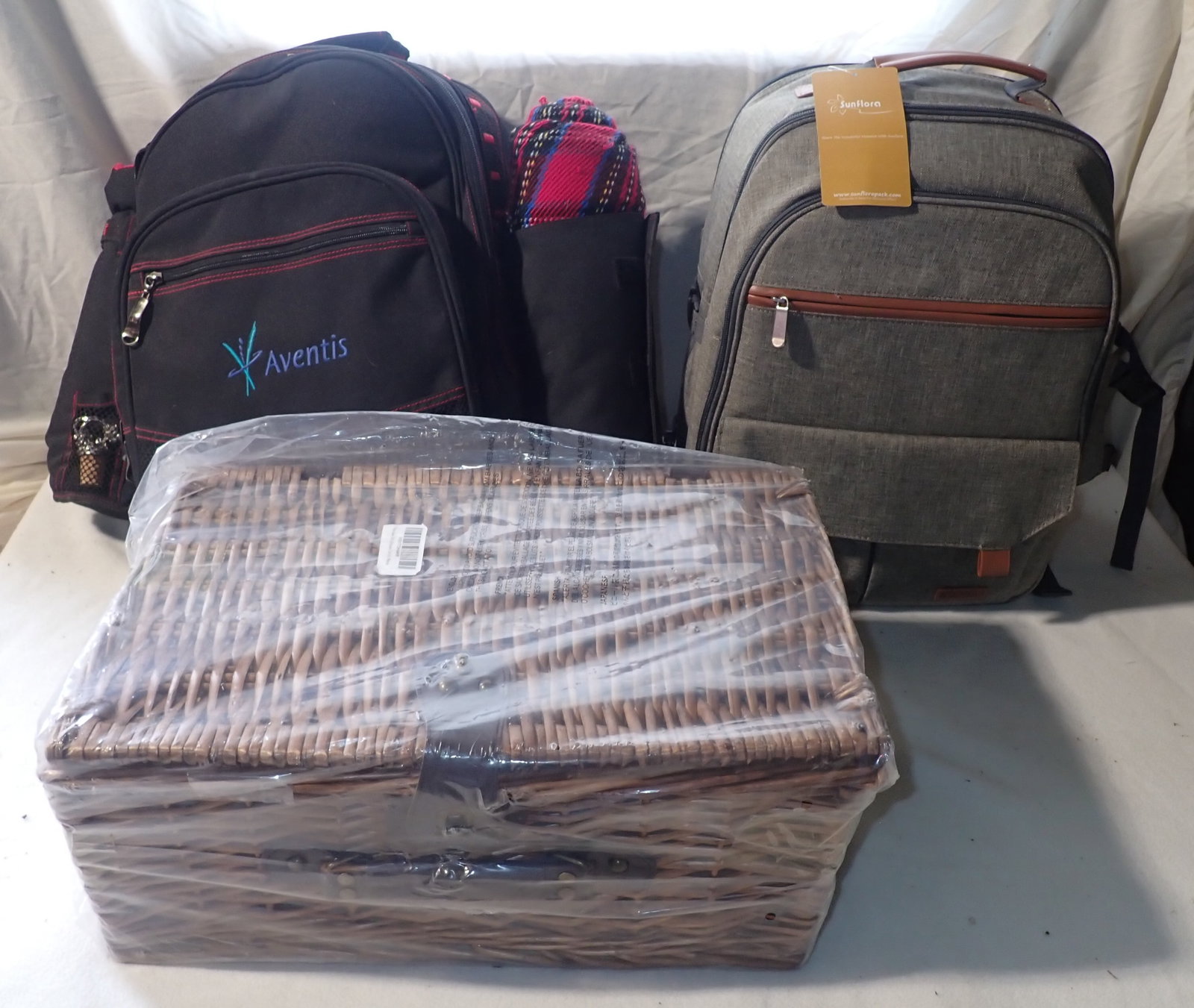 Picnic Baskets & Backpacks incl Sunflora: Basket is approx 11" x 17" x 7 1/4" tall. Shipping available
