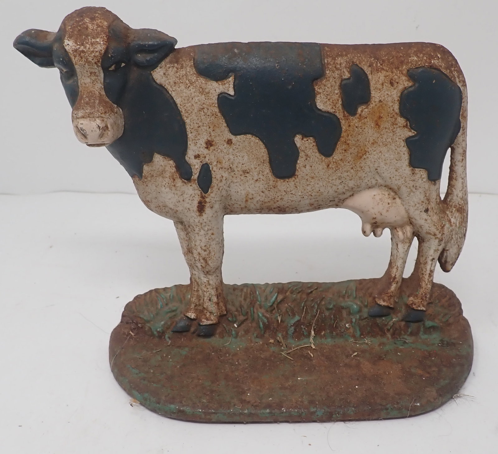 Cast Iron Holstein Cow Doorstop: Apprx 7 1/4" long and 6 1/2" tall. Shipping available