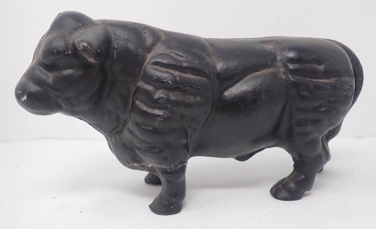 Cast Iron Bull Still Bank: Approx 9 3/4" long and 5" tall. Made of heavy cast iron. Shipping available