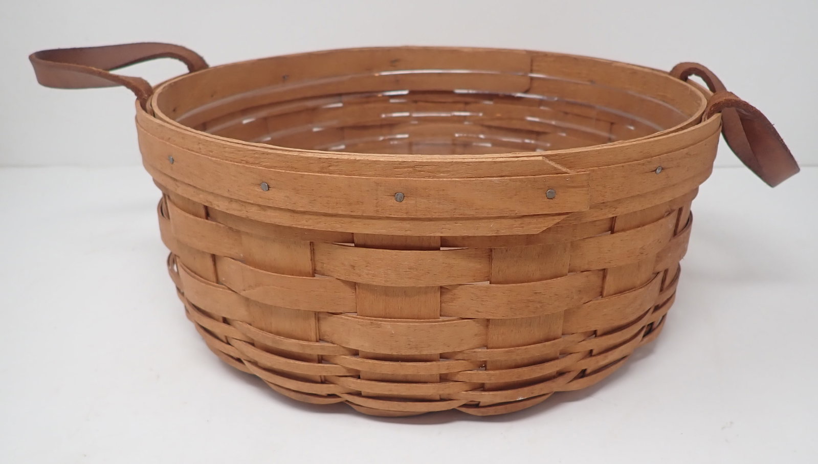 1992 Longaberger Basket: Approx 9 1/2" in diameter and 4 1/4" tall. Shipping available