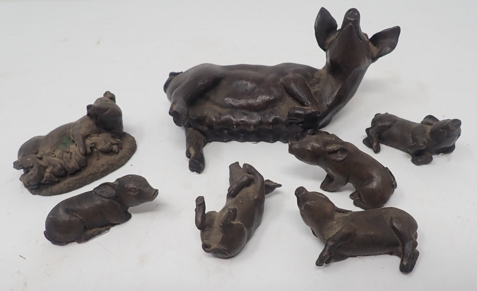 Pig Figurines: Possibly made of resin ?? Largest is apprx 5" long. Shipping available