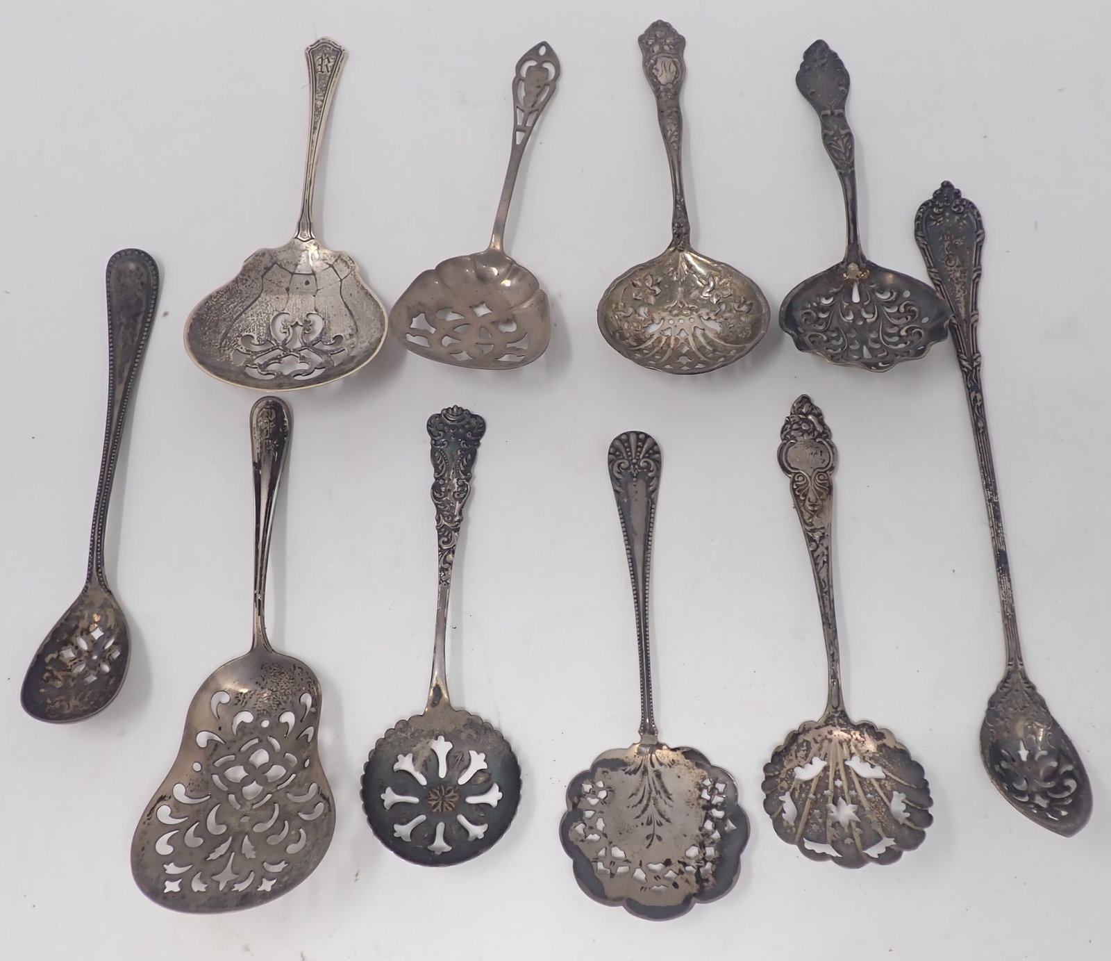 Sterling Silver Pierced Bon Bon, Nut, Sugar Sifter Spoons: Longest is approx 7 3/4". Total weight is apprx 186 grams. Shipping available