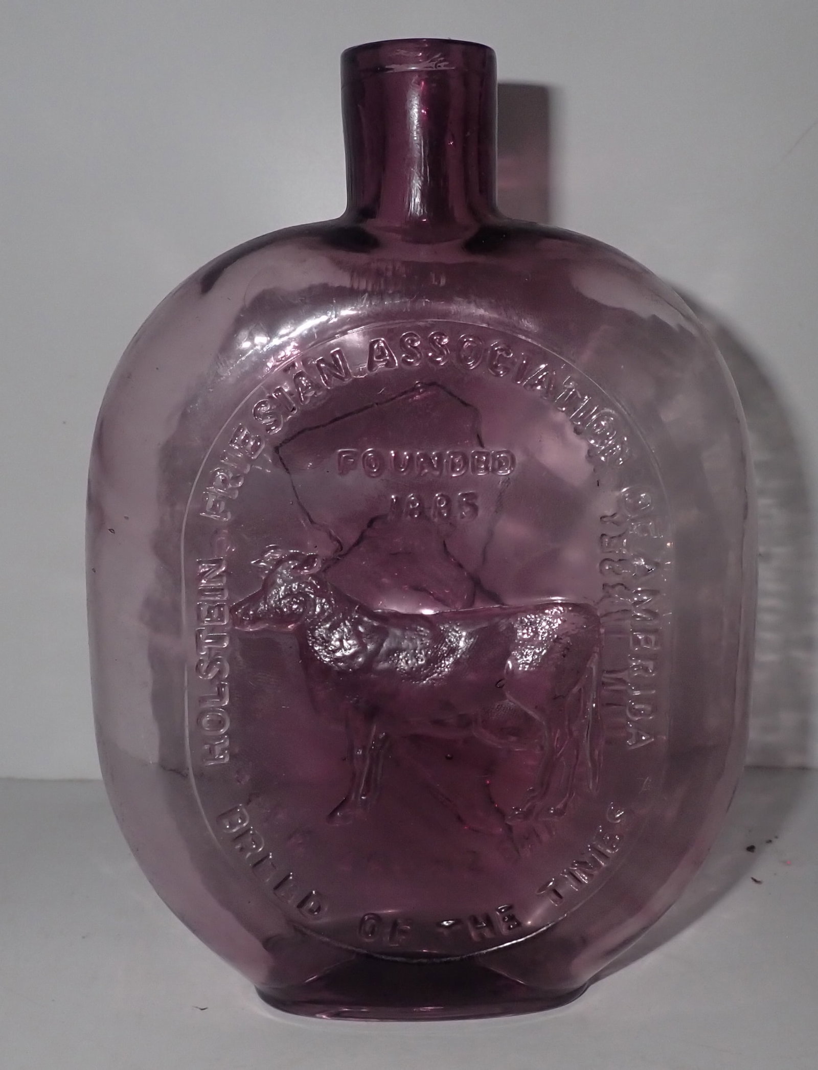 1974 New Jersey Holstein Friesian Cow Bottle: Approx 1 1/2" x 5" x 7 1/4" tall. Shipping available