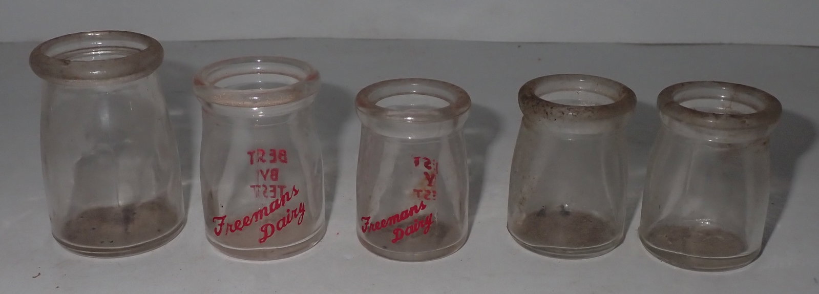Freeman's Dairy Milk Bottles: Two are Freeman's and the others are blank. Tallest is apprx 2 1/4". Shipping available