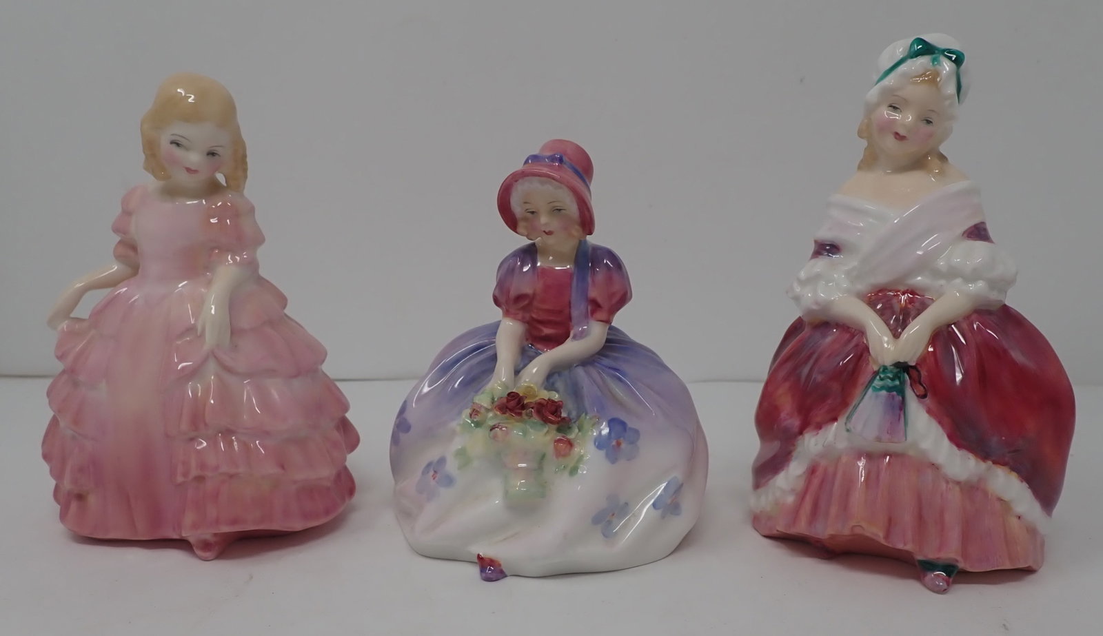 3 Royal Doulton Victorian Figurines: Tallest is apprx 5 1/2" tall. Shipping available