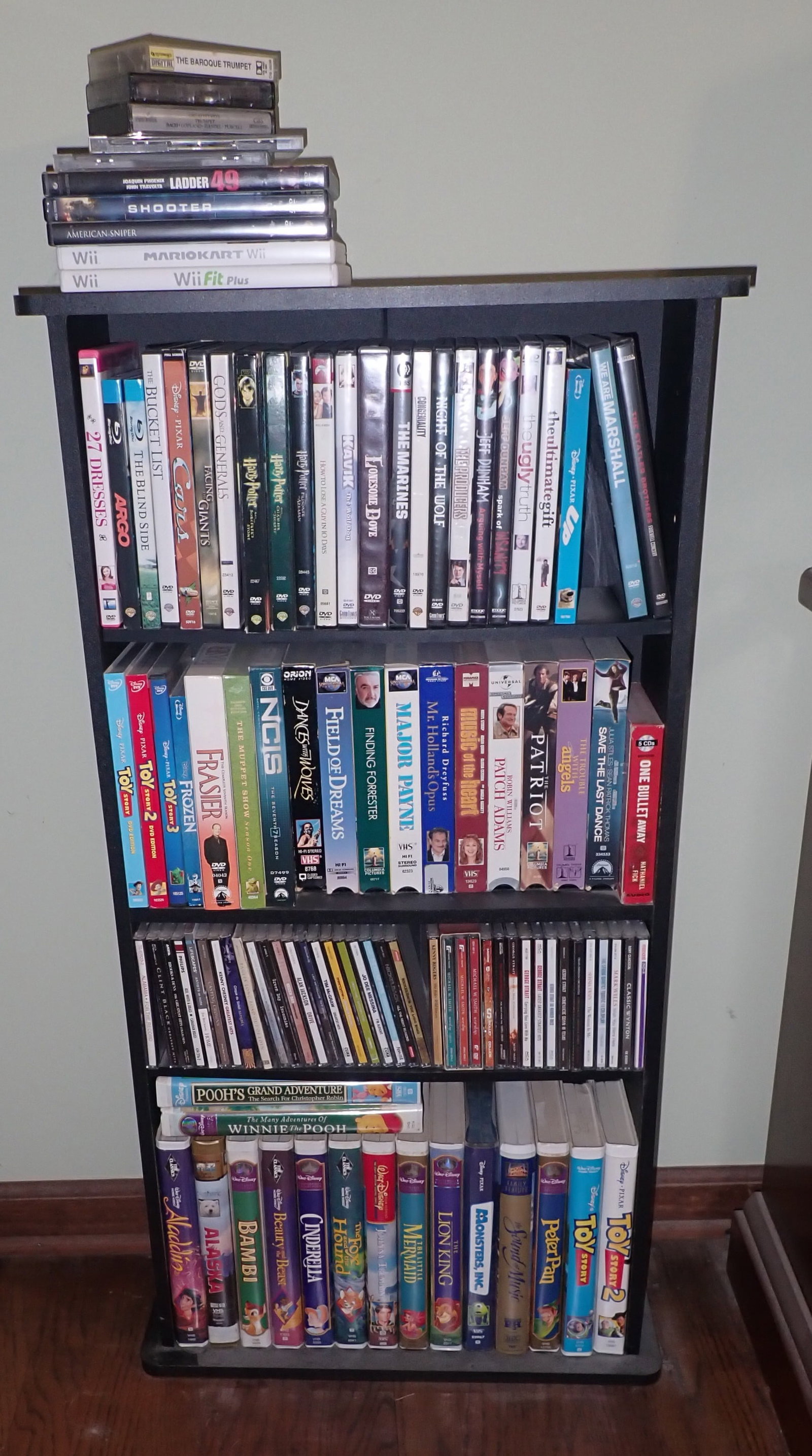 Cd's & Dvd's incl Disney , Harry Potter , & Misc: Cabinet is included. We do not guarantee all cases have the correct disc in them or that any are missing discs. We will ships cd's & dvd's but not cabinet.