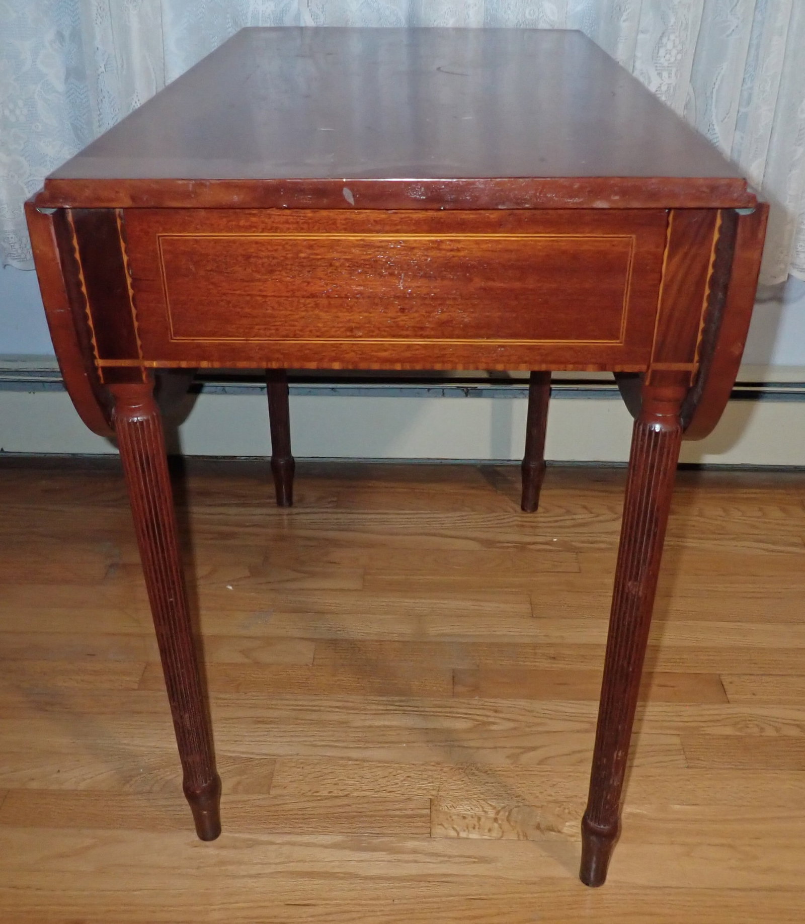 Reeded Leg Marquetry Drop Leaf Table: Approx 19 1/2" wide ( with leaves down) x 34" x 28 3/4" tall. NO in house shipping !