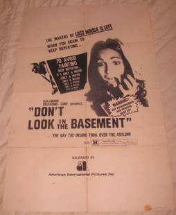 DON'T LOOK IN THE BASEMENT MOVIE POSTER: This is approx. 27" x 41" Has creases from being folded when stored. Released by American International Pictures. Has some small stains on edges, small hole on left side in middle, and very small